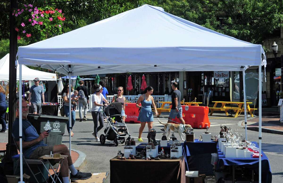 The annual Arts & Crafts on Bedford event on Bedford Street in downtown Stamford, Conn., on Saturday September 10, 2022. Arts & Crafts on Bedford brings juried artisans from throughout the Northeast who will display and sell juried works including ceramics, fiber arts, fine art, jewelry, metal, photography, painting, wood and more. Arts & Crafts on Bedford is presented by Stamford Downtown Special Services District and sponsored by 95.9 The Fox, Star 99.9, WEBE 108 and Happyhaha.com Photography.