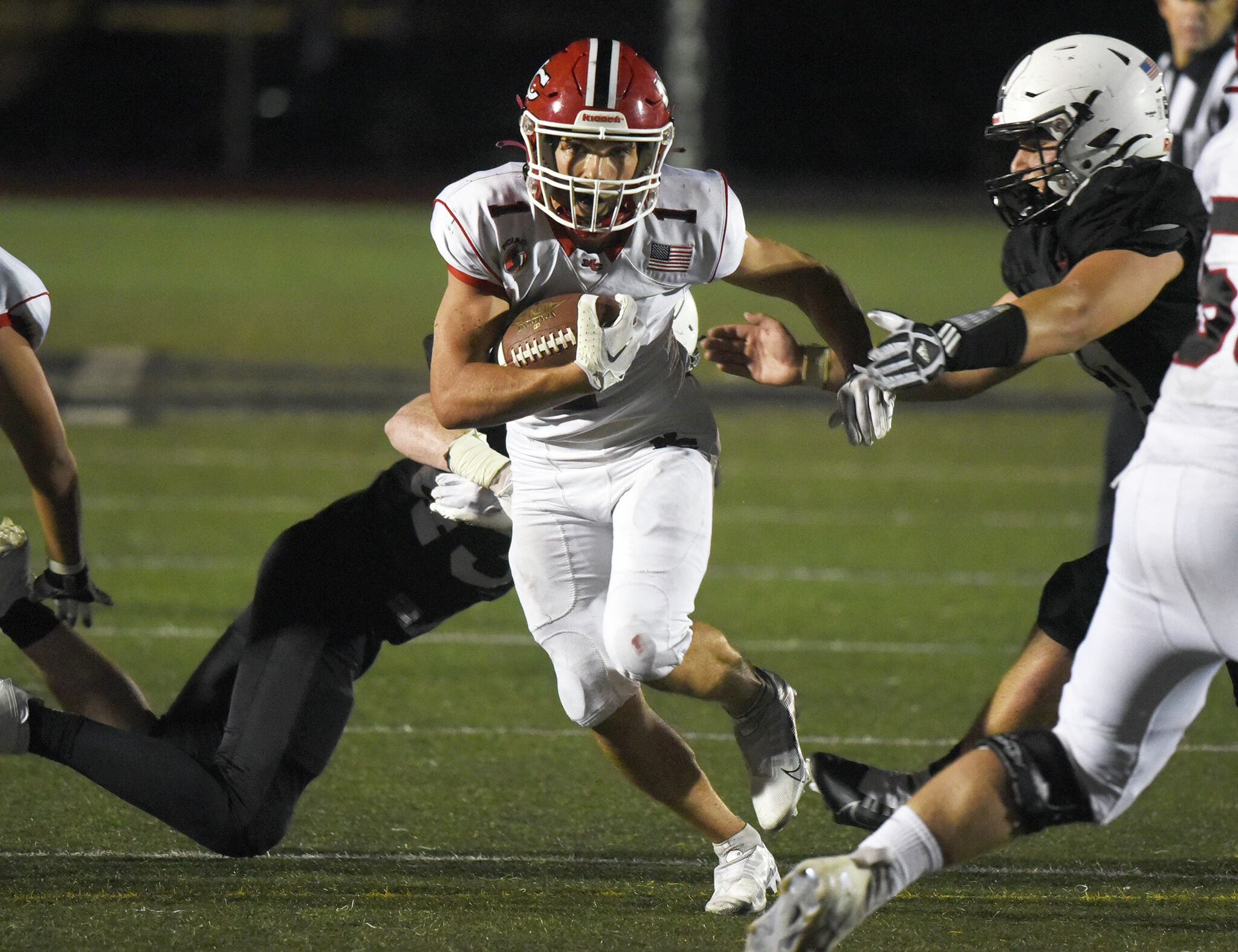 New Canaan football tops Warde for eighth victory