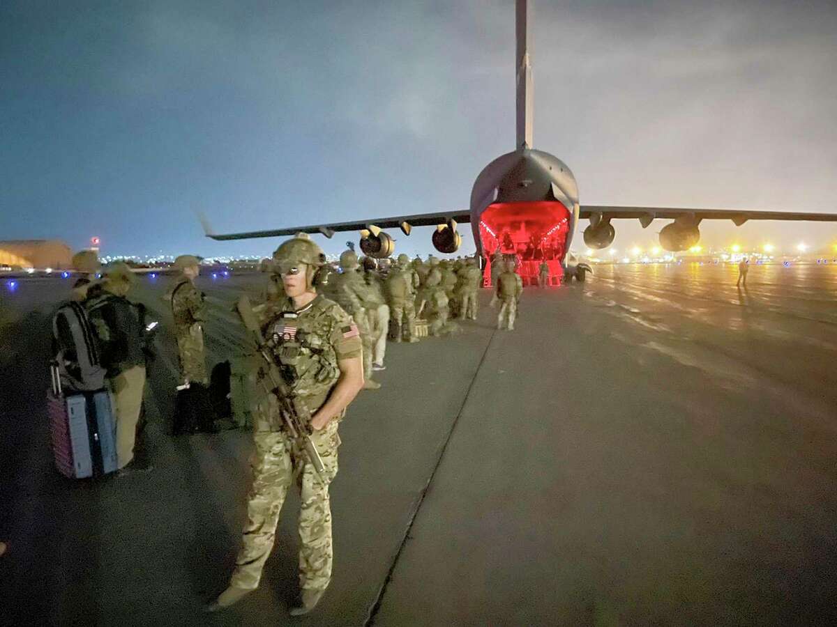 U.S. Army prepare to board a C-17 cargo plane at Hamid Karzai International Airport in Kabul, Afghanistan in August of 2021. The the staggering 124,000 people evacuated from Afghanistan in hellish circumstances is a testament to the empowerment of the lowest ranking members of the U.S. military and the tactical accomplishments this empowerment can achieve.