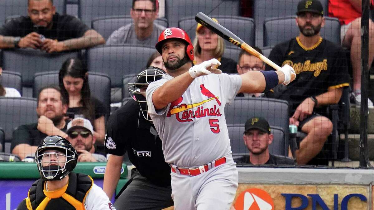St. Louis Cardinals' Albert Pujols watches his 697th career home run, a two-run home run off Pittsburgh Pirates relief pitcher Chase De Jong, during the ninth inning of a game in Pittsburgh, Sunday, Sept. 11, 2022.