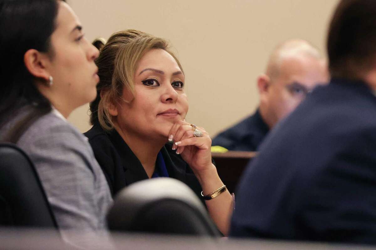 Convicted ex-constable Michelle Barrientes Vela, convicted recently of two counts of tampering with evidence, listens to her attorney, Jason Goss, during her sentencing hearing on Monday.