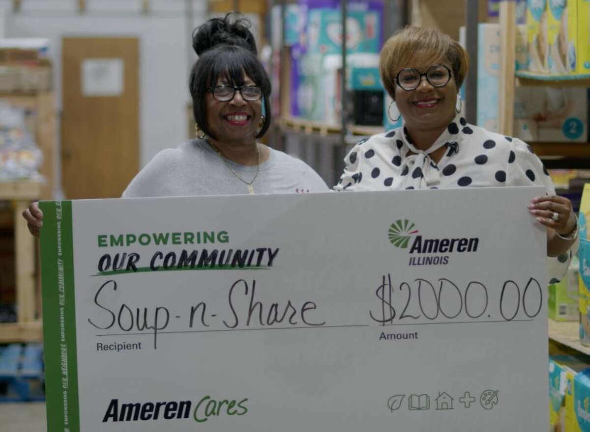 Sherrie Hare, left, Executive Director of Soup N Share, in Madison, accepts a $2,000 contribution of behalf of Ameren Illinois from Paula Nixon, community relations executive from Ameren Illinois. Soup N Share serves clients and agencies throughout Madison County.  