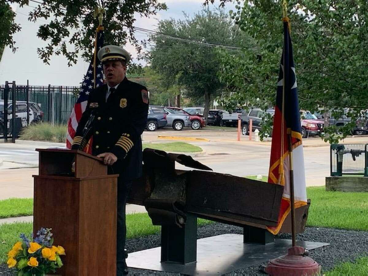 Bellaire Fire Chief Deacon Tittel speaks during a remembrance ceremony on Sunday, Sept. 11, 2022, next to an I-beam recovered from one of the Twin Towers that was toppled as part of the Sept. 11, 2001, terrorist attacks in New York City, Pennsylvania and Washington, D.C.