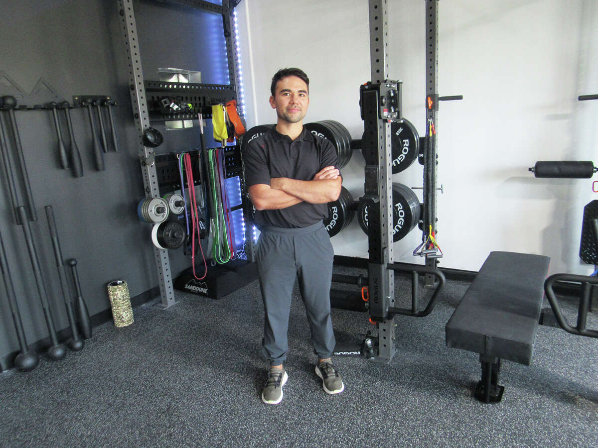 Dr. Pablo Orozco stands in front of the fitness facility at Performance Chiro+ in Edwardsville. The clinic opened on Aug. 29 at its new location at 215 S. Kansas St., Suite 101.