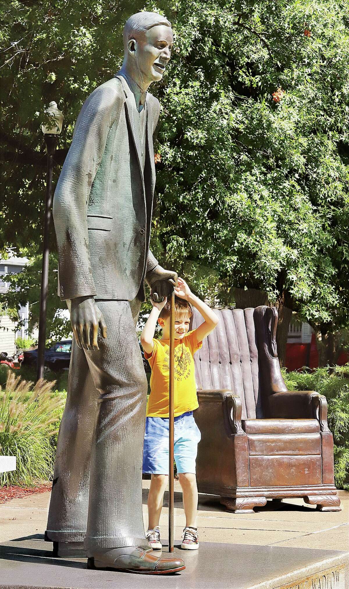 John Badman|The Telegraph Denver Jaco, 8, of Edwardsville, who is being home schooled, learned Tuesday that he was as tall as Robert Wadlow's cane. Denver was visiting the statue of Wadlow, the tallest man in the world, with family members as part of their home education. It was a great day for anything outdoors Tuesday, but temperatures are forecast to climb a few degrees all week and be in the low 90's by the weekend.