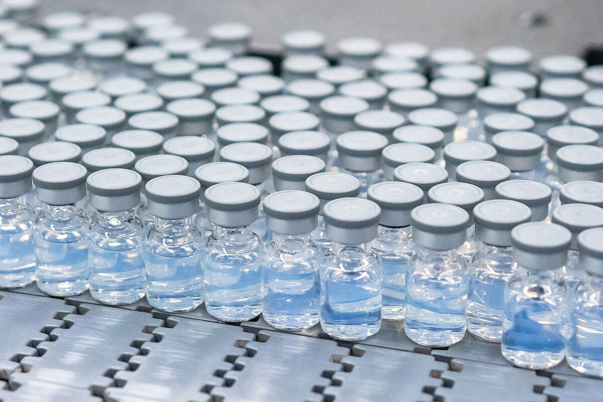 This August 2022 photo provided by Pfizer shows vials of the company's updated COVID-19 vaccine during production in Kalamazoo. U.S. regulators have authorized updated COVID-19 boosters, the first to directly target today's most common omicron strain. 