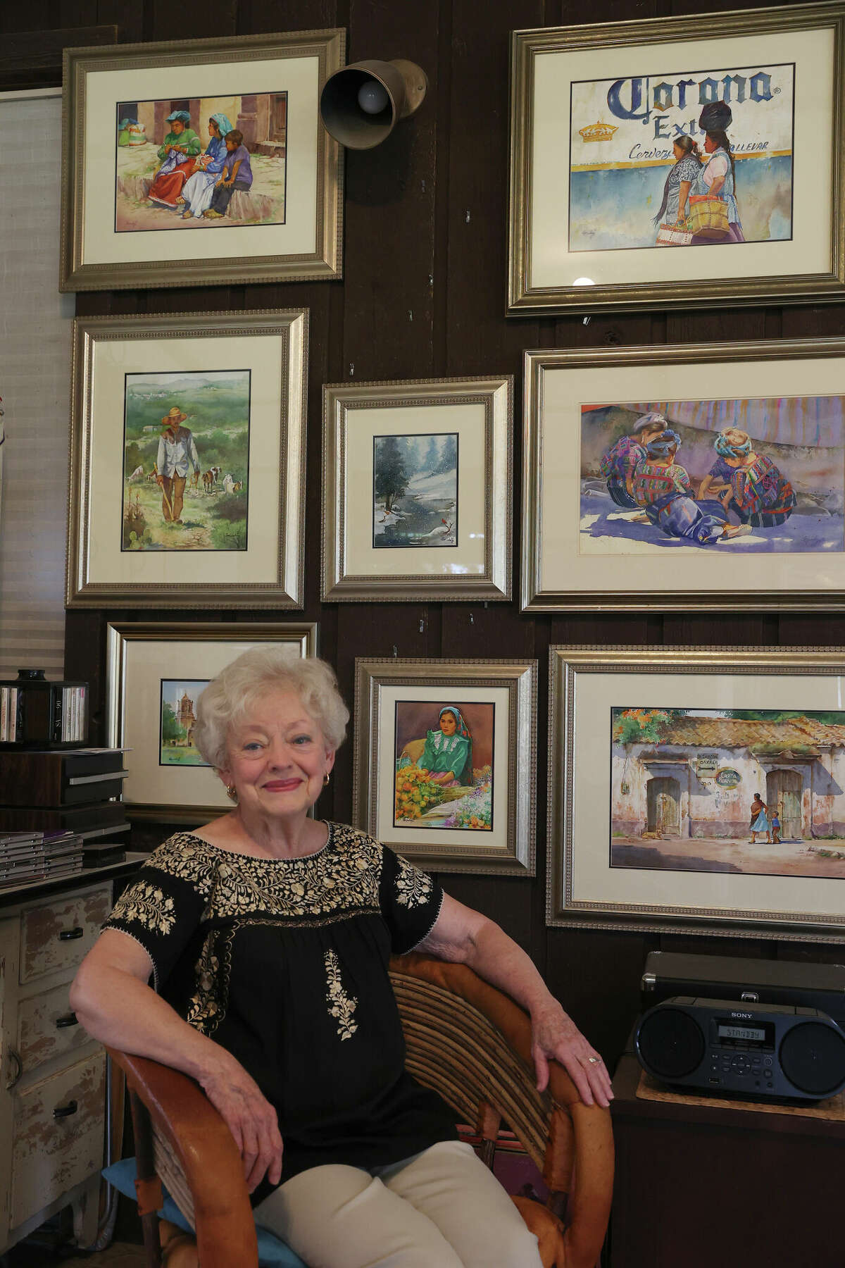 Edith Maskey, 81, of Comfort sits before some of her artwork. Her artwork will be shown during the 2022 Texas Arts and Craft Fair held  at the Hill Country Arts Foundation in Ingram on Sept 24 and 25.