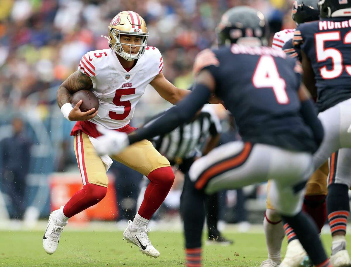 San Francisco 49ers’ Trey Lance looks for running room during 2nd quarter of 19-10 loss to Chicago Bears during NFL game at Soldier Field in Chicago, IL, on Sunday, September 11, 2022.