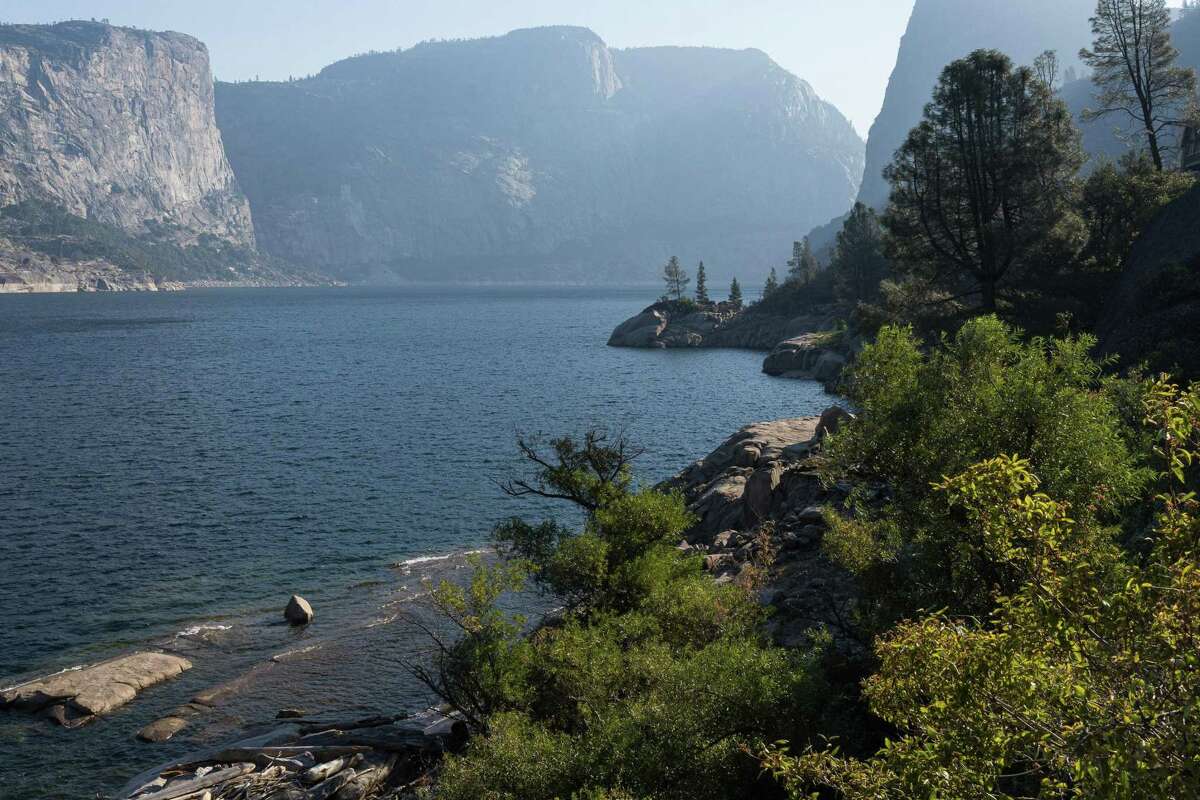 Smoke from nearby fires creates hazy conditions over the Hetch Hetchy Reservoir in Yosemite National Park, Calif., on September 1, 2022.