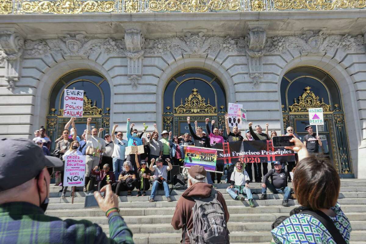 Dozens of people rallied on the steps of San Francisco City Hall in March in support of increased HIV public health efforts after two years of pandemic slippage.