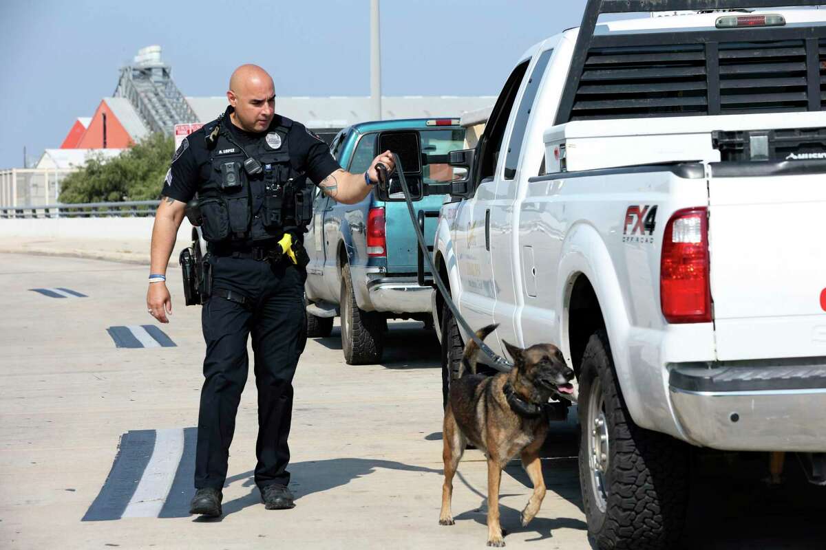 San Antonio Airport Police K9 Unit Sgt. Andres Lopez trains Keyno, a 5-year-old Belgian Malinois, at San Antonio International Airport on Tuesday. The unit’s dogs are trained to find explosives.
