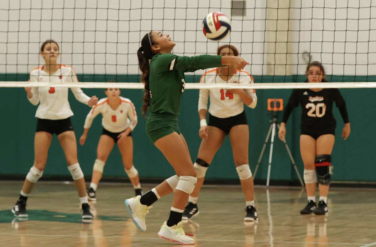 Southwest’s Annelise Castillo (03) sets up the play against Medina Valley in girls volleyball at Southwest High School on Tuesday, Sept. 13, 2022. Southwest defeated Medina Valley in three-straight games.