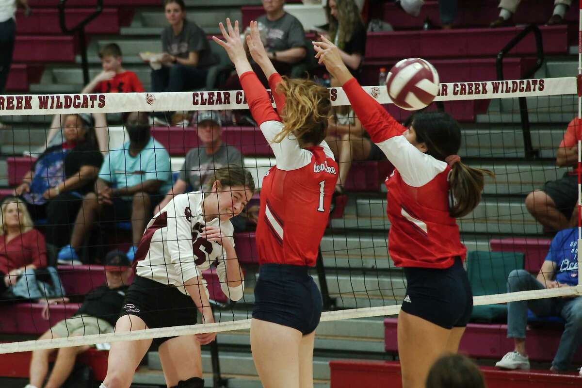 Clear Creek’s Stratton Sneed (16) tries to hit a shot past Clear Lake’s Annie Cathey (1) and Clear Lake’s Samantha Espinoza (18) Tuesday, Sep. 13, 2022 at Clear Creek High School.