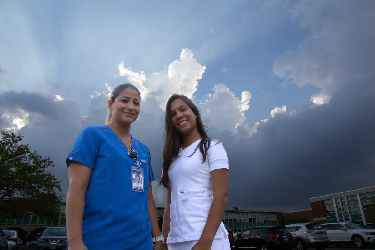 Two of Norwalk Community College's recent nursing graduates, Jaquiline Yanes, left, and Adriana Rosario, both of Norwalk, were part of the school's nursing program, which is now partnering with Stamford and Norwalk hospitals.