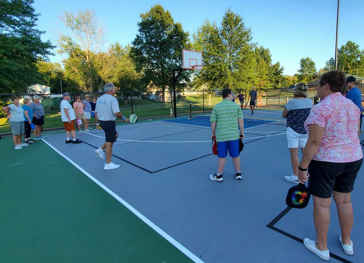 Jorge Salgueiro, center, a certified  USAPickleball coach and member of the Riverbend Pickleball Group, instructs workshop participants on Sept. 8. A pickleball tournament is planned Sept. 23-25 in Jerseyville.
