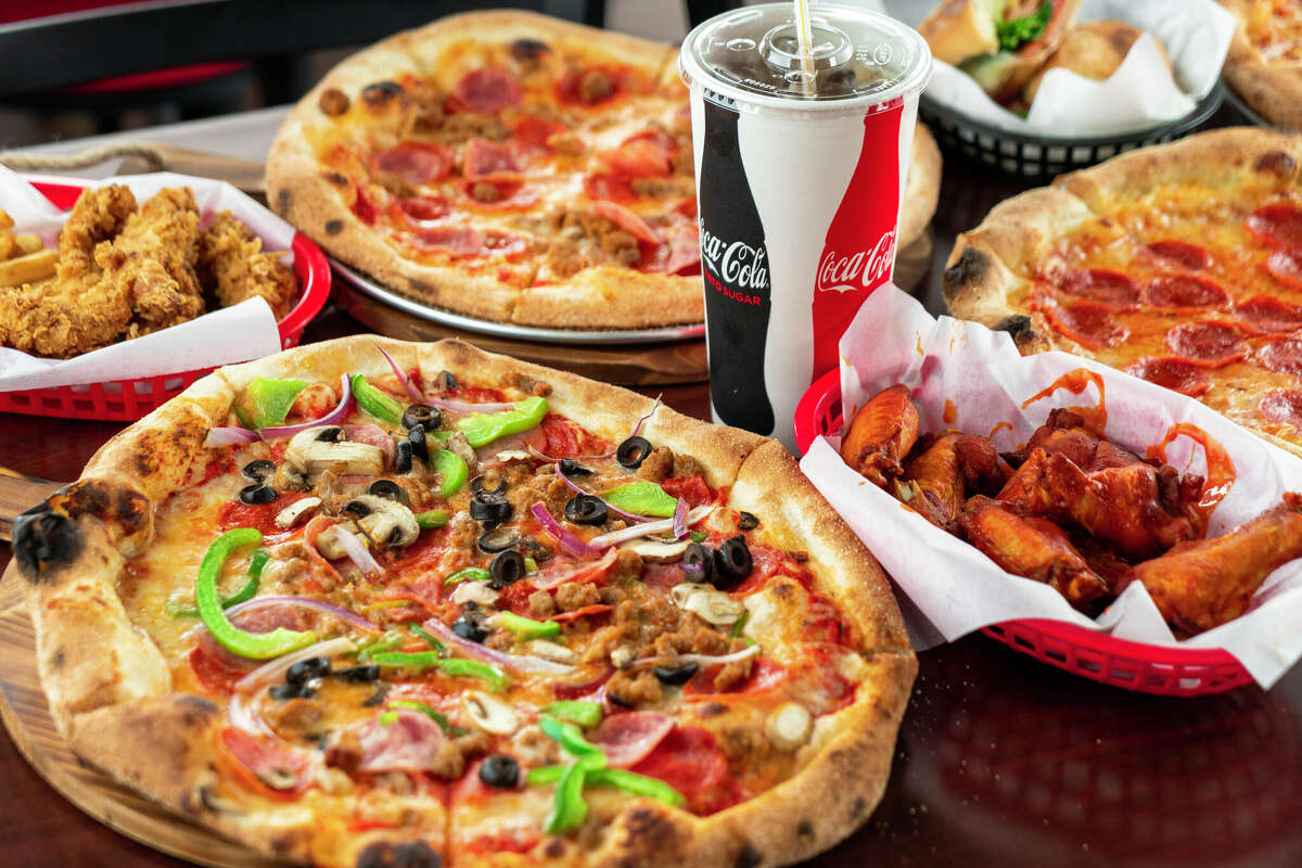 A photo of 7Pie's offerings, including pizza, chicken wings and chicken tenders.