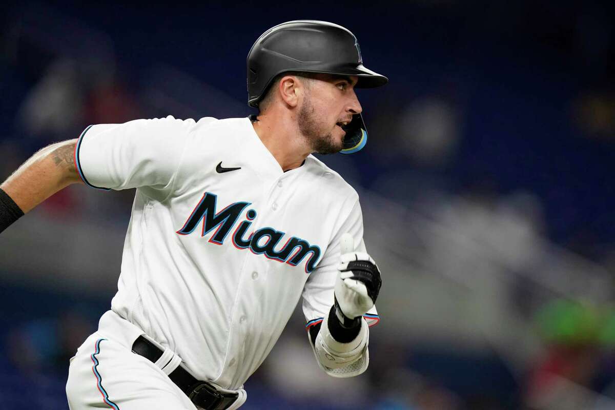 Miami Marlins' Jordan Groshans runs as he flies out during the third inning of a baseball game against the Philadelphia Phillies, Tuesday, Sept. 13, 2022, in Miami. (AP Photo/Lynne Sladky)