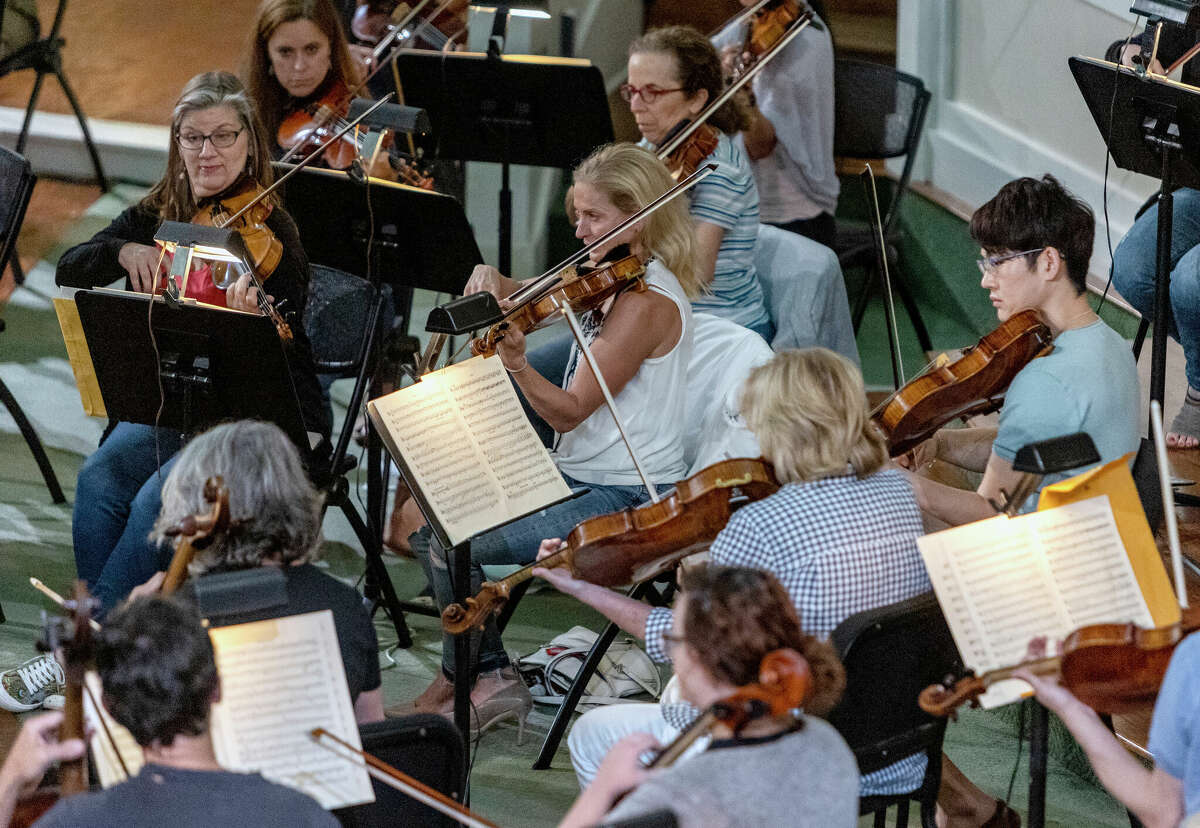 Musicians who once played with the San Antonio Symphony -- shown rehearsing for a concert they produced independently in May -- start a new era as the San Antonio Philharmonic this weekend.  