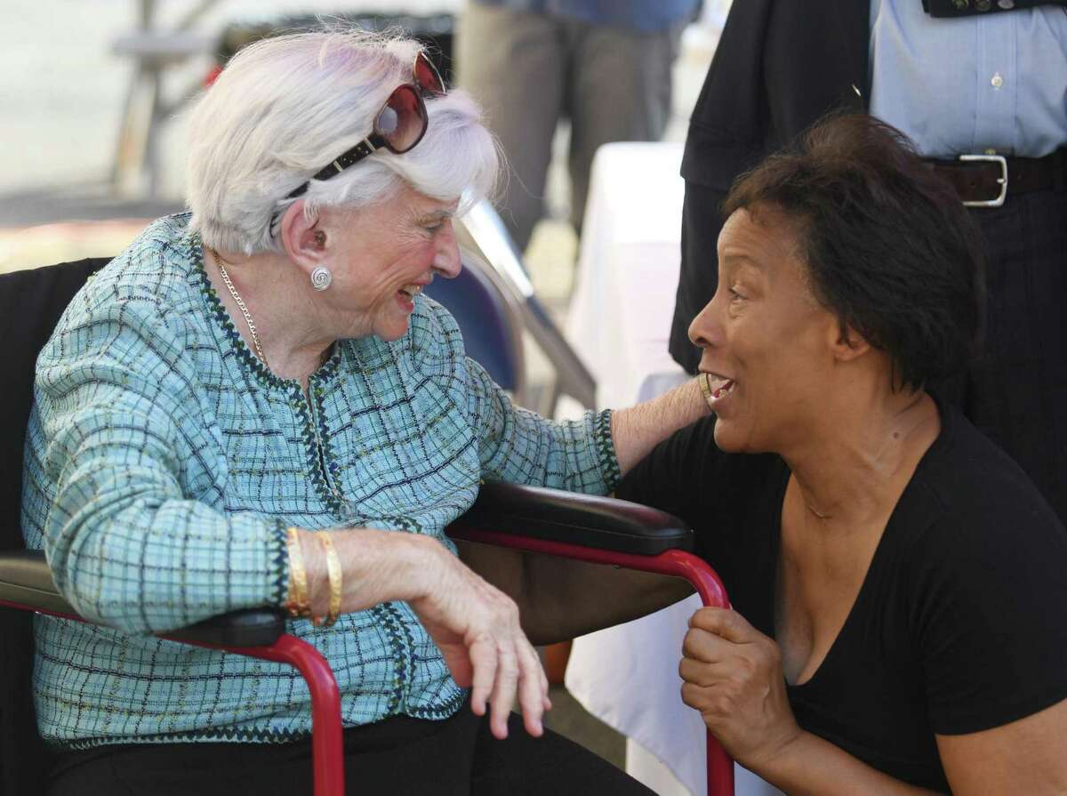 Barbara Nolan, 90, chats with Cheryl Ann Robinson, who used CCI's services when she was a child, during the ribbon-cutting of Barbara's House in the Chickahominy section of Greenwich, Conn. Tuesday, Sept. 13, 2022. The local nonprofit Community Centers Inc. changed its name to Barbara's House as a tribute to Barbara Nolan, who was CCI's founding executive director.