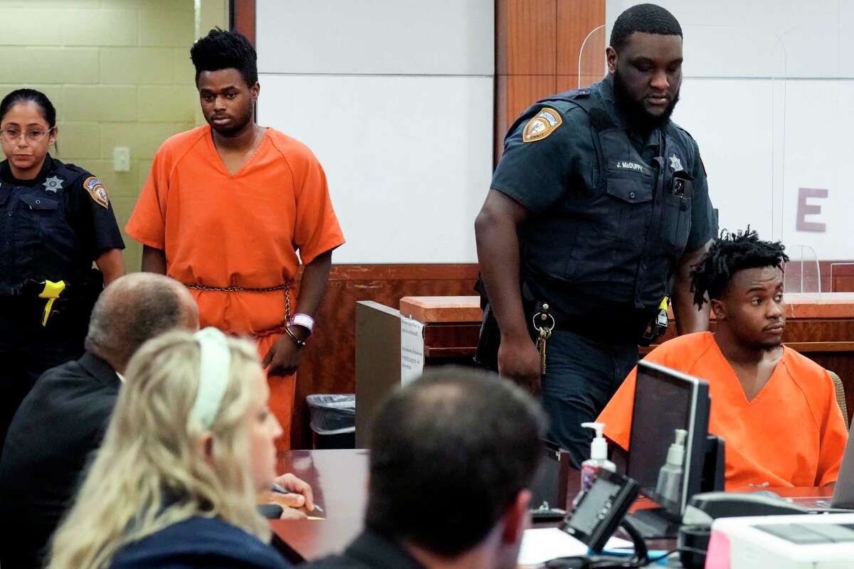 Jayland Womack, left, and Ahsim Taylor, Jr., are brought into the courtroom for a bail hearing in front of visiting Judge Denise Collins in the 263rd District Court on Wednesday, Sept. 14, 2022, in Houston. Womack and Taylor are accused in the death of a Harris County constable’s deputy with Precinct 3. The pair are being held without bond.