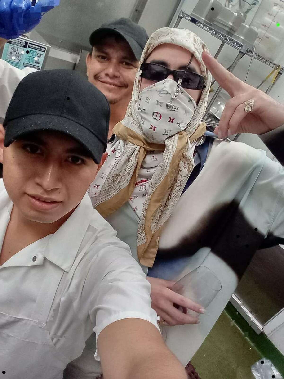 Bad Bunny (right) posed for photos with Deybith Hernandez (front) and David Chavarria (back) at Sol Food in San Rafael while in the Bay Area.