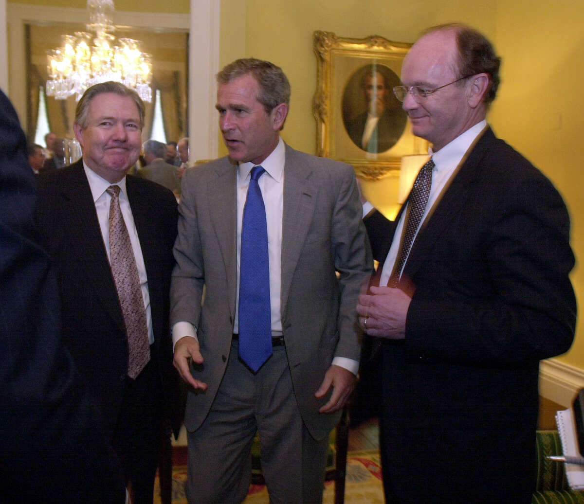 Texas Gov. George W. Bush, center, meets with Hearst Corporation executives Frank Bennack, left, and George Irish, during a meeting with the Hearst Newspapers editors at the Governor's Mansion in Austin, Texas on Wednesday, June 7, 2000.