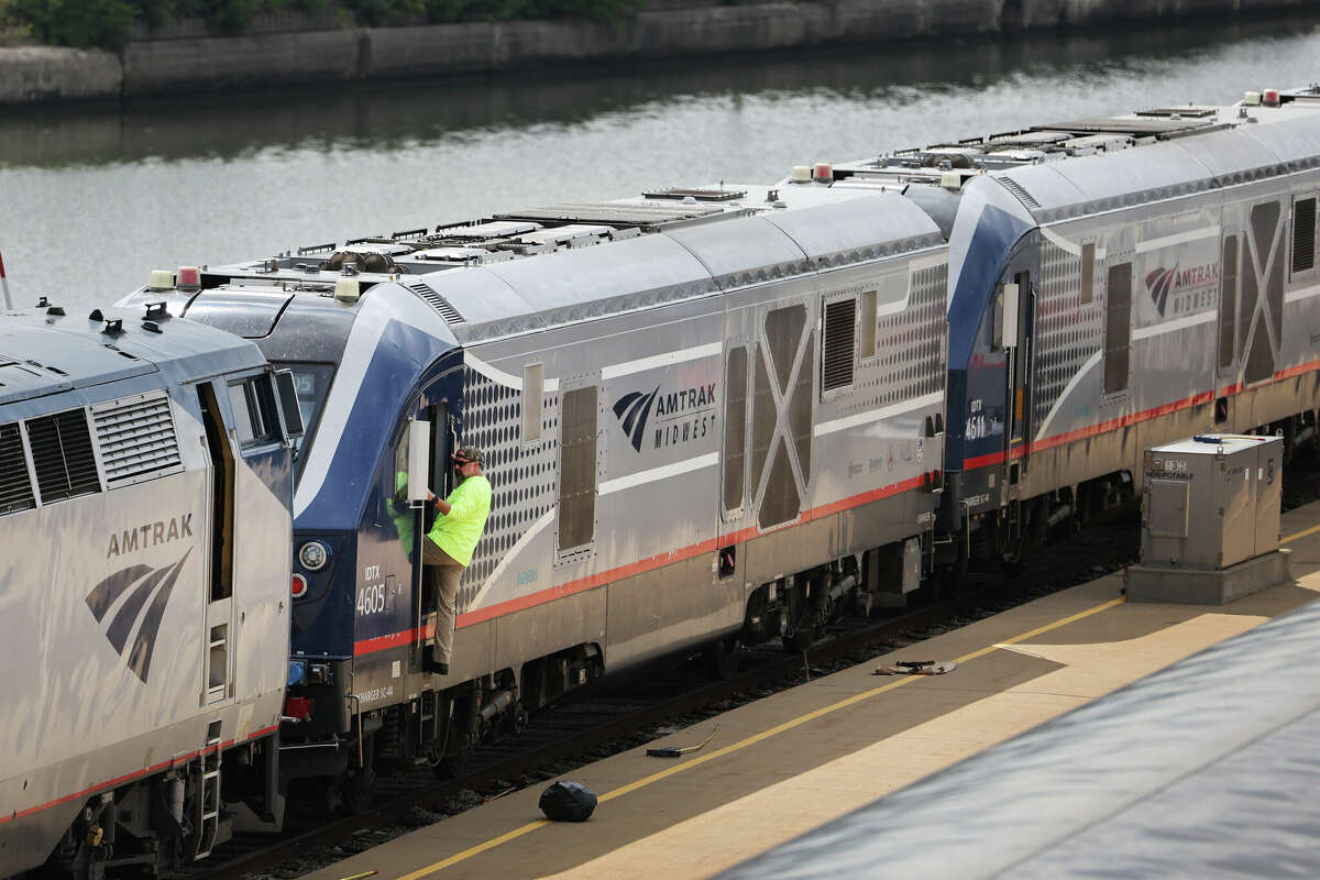 FILE - Workers service trains in the Amtrak Car Yard south of the Loop on September 13, 2022 in Chicago, Illinois.