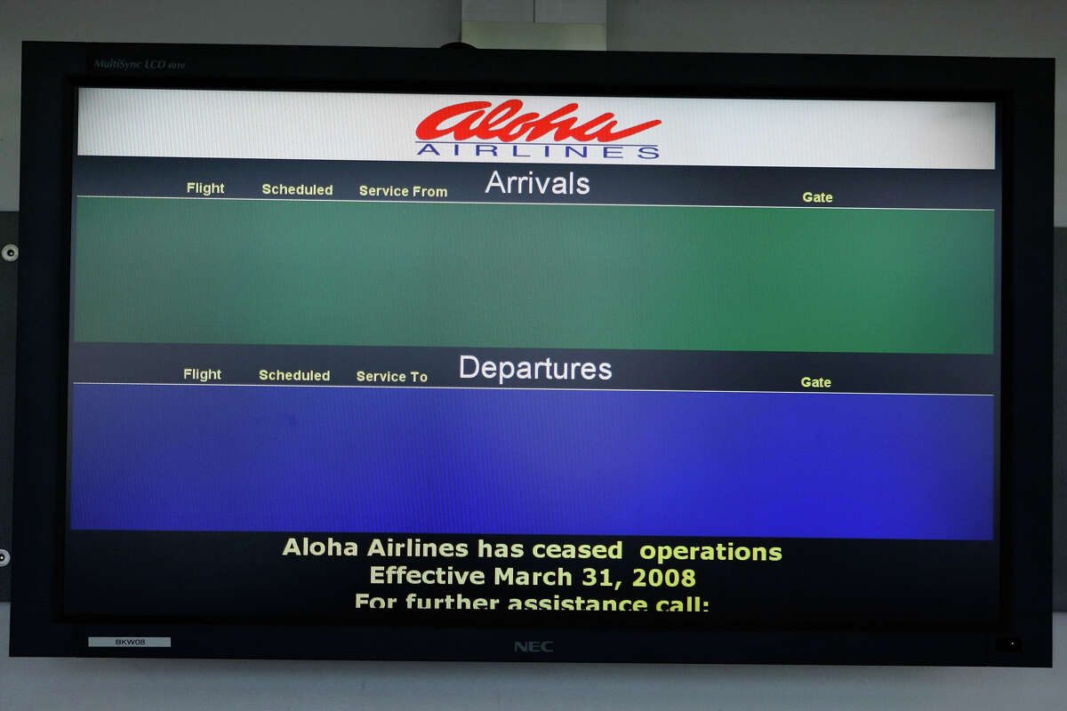 A monitor is void of scheduled arrival and departure information at an empty Aloha Airlines ticket counter at Oakland International Airport on March 31, 2008, in Oakland, Calif. After 60 years in business, Aloha Airlines announced that it had ceased all passenger service after March 31 following a filing for Chapter 11 bankruptcy protection on March 21, 2008. 