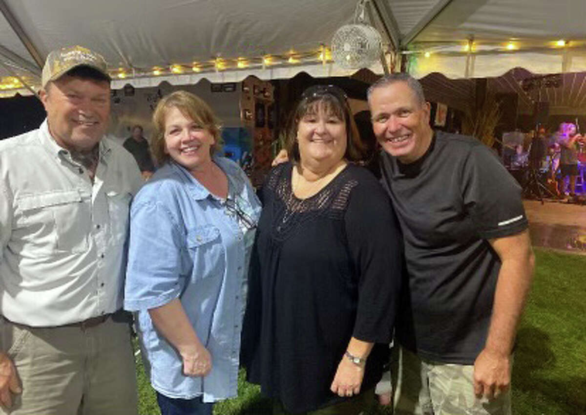 AMH leadership, left to right, Dave Braasch, Cindy Bray, Debbie Turpin and Rusty Ingram enjoy the annual Duck Pluckers Ball.