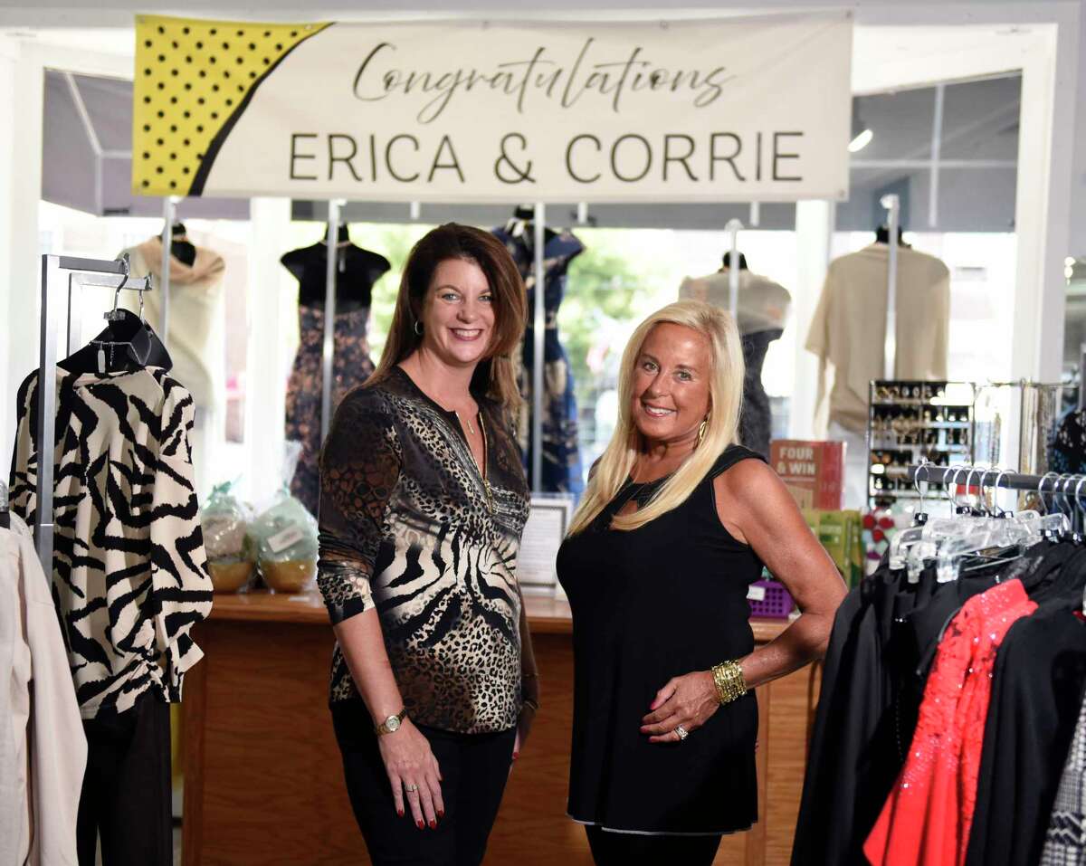 Longtime owner Erica Jensen, right, and new owner Corrie Bellardinelli pose together at Helen Ainson in Darien, Conn. Wednesday, Sept. 14, 2022.