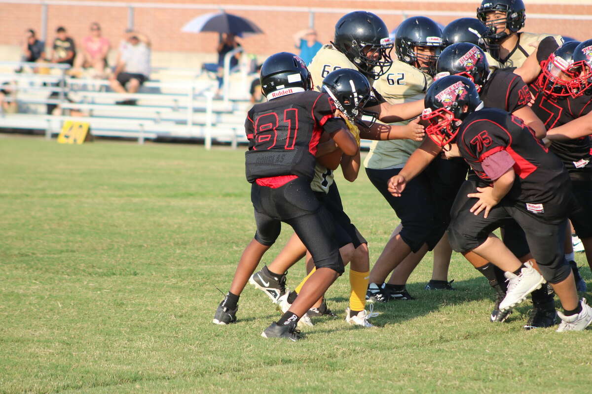 The San Jacinto Intermediate School 7A defense stops Miller quarterback Noe Slattery in his tracks during their game this week. Next Monday, the two programs begin divisional games.