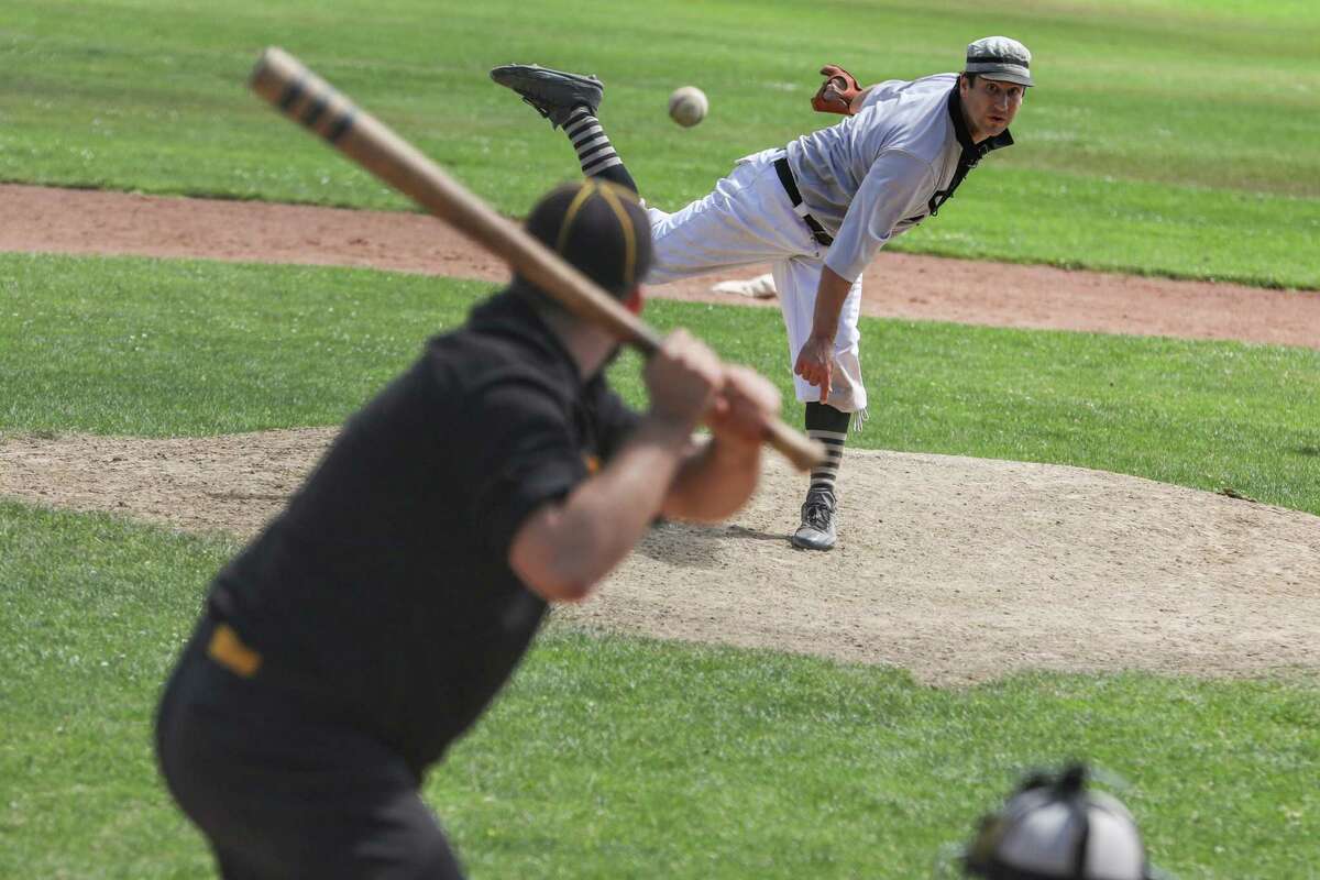 San Francisco Pacifics' Will Hartman throws a pitch in a game against the Dublin Aces at Big Rec Ballfield in Golden Gate Park in San Francisco on Aug. 28. Bay Area Vintage Baseball is a league in which teams dress and play according to 1880s rules.