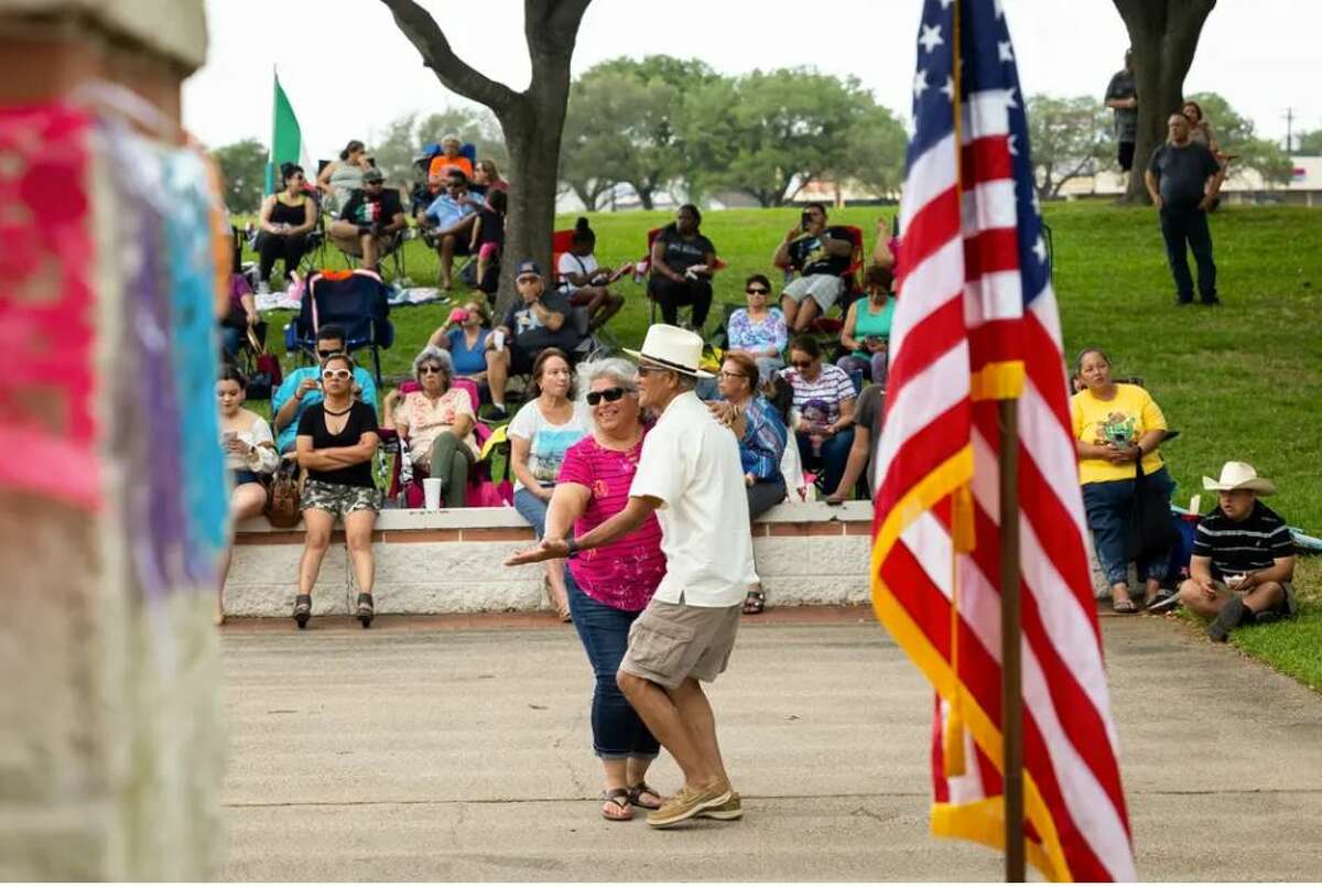 Josie and Santos Ramos dance during a Cinco de Mayo parade and festival on April 30. The couple have been married for 49 years and raised their family in Texas City. Credit: Annie Mulligan for The Texas Tribune