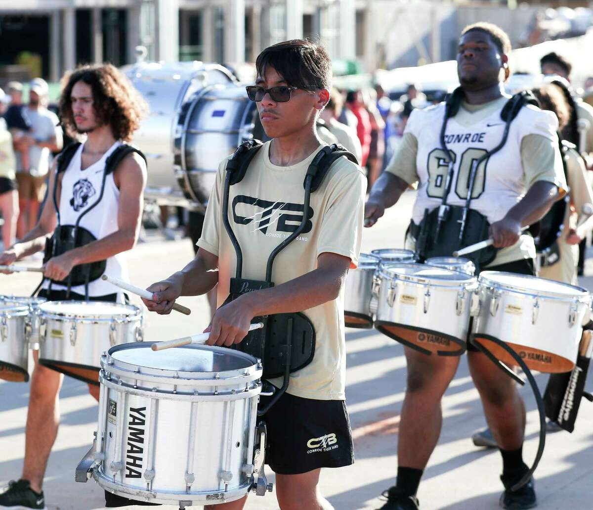 Members of the Conroe Tiger Band drum line perform during Conroe High School’s homecoming parade, Wednesday, Sept. 14, 2022, in Conroe.