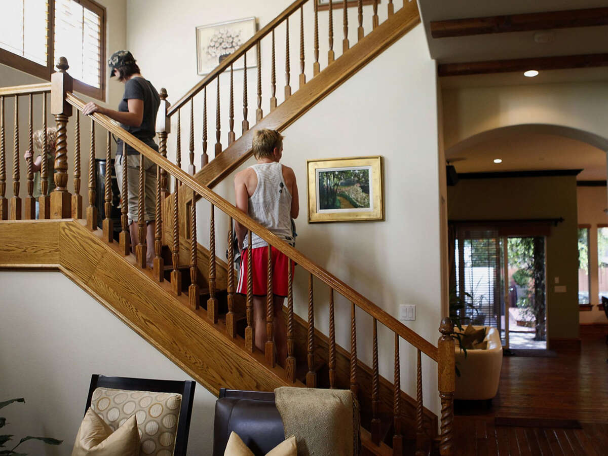 Potential home buyers take a tour during an open house in Manhattan Beach, California.