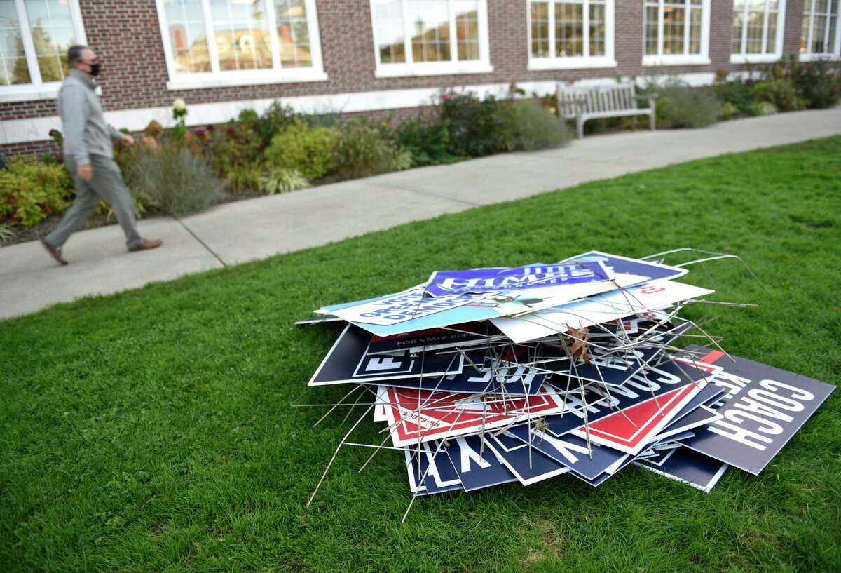 A pile of political signs outside Town Hall in Greenwich on the day after Election Day in 2020.