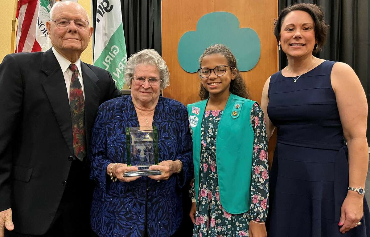 The inaugural Distinguished Community Leader Award was presented Sept. 10 to Ralph and Donna Korte of Highland, left, pictured with their great granddaughter, Melia, and Deanna Litzenburg, Girl Scouts of Southern Illinois Board Chair.