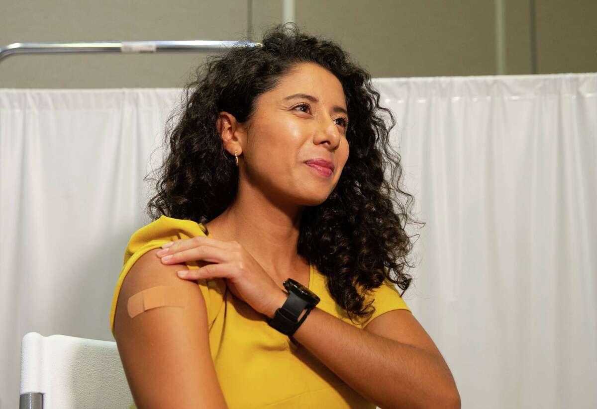 County Judge Lina Hidalgo shows her band-aid after receiving COVID-19 vaccine booster after recommending the public to do so Thursday, Sept. 15, 2022, at The Health Museum in Houston. Hidalgo also talked about the health budget for the county.