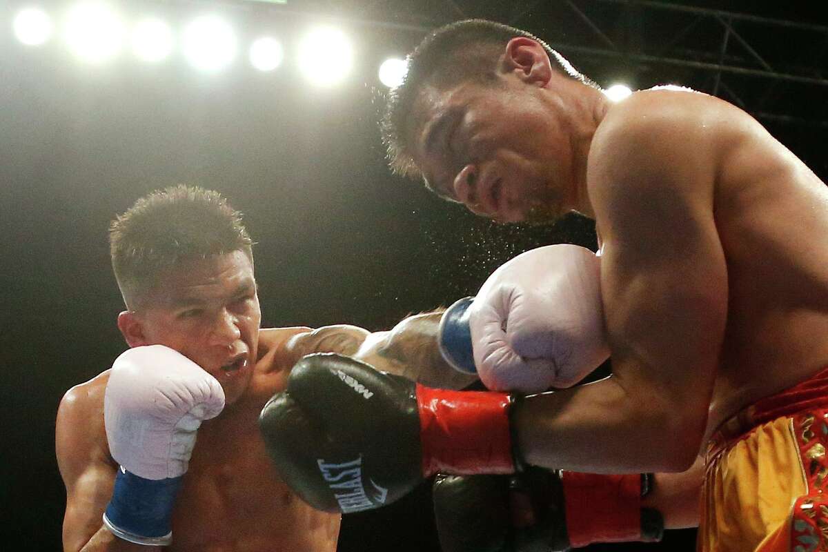 Super flyweight Jesse ‘Bam’ Rodriguez, 22, at left, is boxing’s youngest world champion.