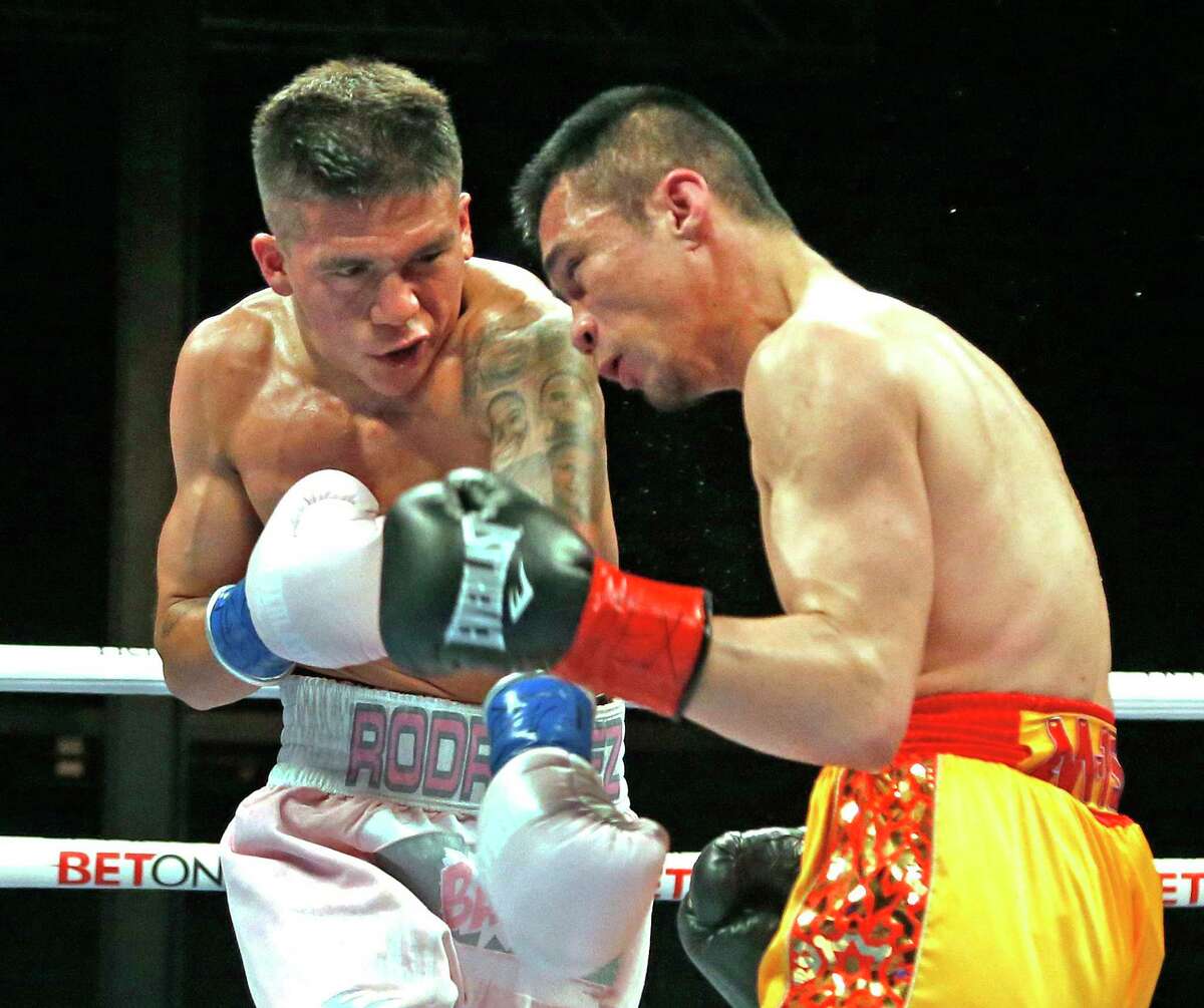 Jesse ‘Bam’ Rodriguez,white shorts, fighting Srisaket Sor Rungvisai as he defends his WBC World Super-Flyweight title on Saturday June 25, 2022 at the Tech Port Arena in San Antonio.