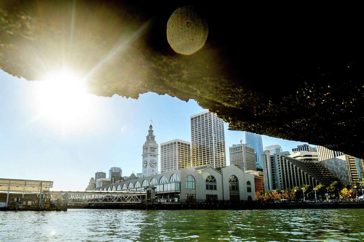 The Ferry Building as seen through a crumbling section of Pier 1.