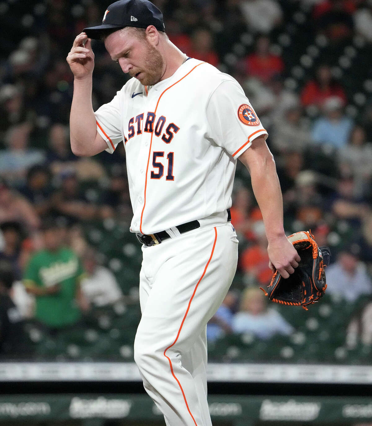 Houston Astros relief pitcher Will Smith (51) reacts as he walked back to the dugout as he was pulled after Oakland Athletics Sean Murphy tripled off of him during the eighth inning of an MLB baseball game at Minute Maid Park on Thursday, Sept. 15, 2022 in Houston.
