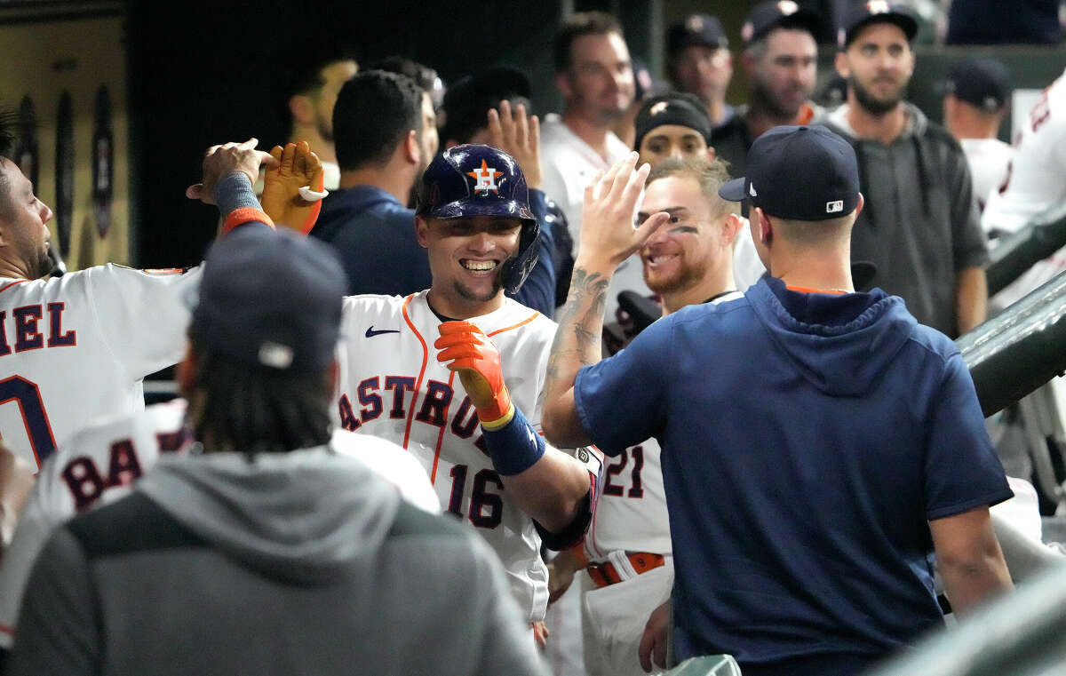 Houston Astros Aledmys Diaz (16) celebrates with teammates in the dugout after hitting a two-run home run Oakland Athletics relief pitcher Joel Payamps during the seventh inning of an MLB baseball game at Minute Maid Park on Thursday, Sept. 15, 2022 in Houston.