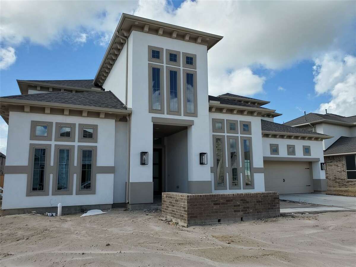 This 4,511-square-foot modern style home by Newmark Homes in the Bridgeland community in Cypress is on the market for just under $1 million. The house offers five bedrooms and five and a half baths.
