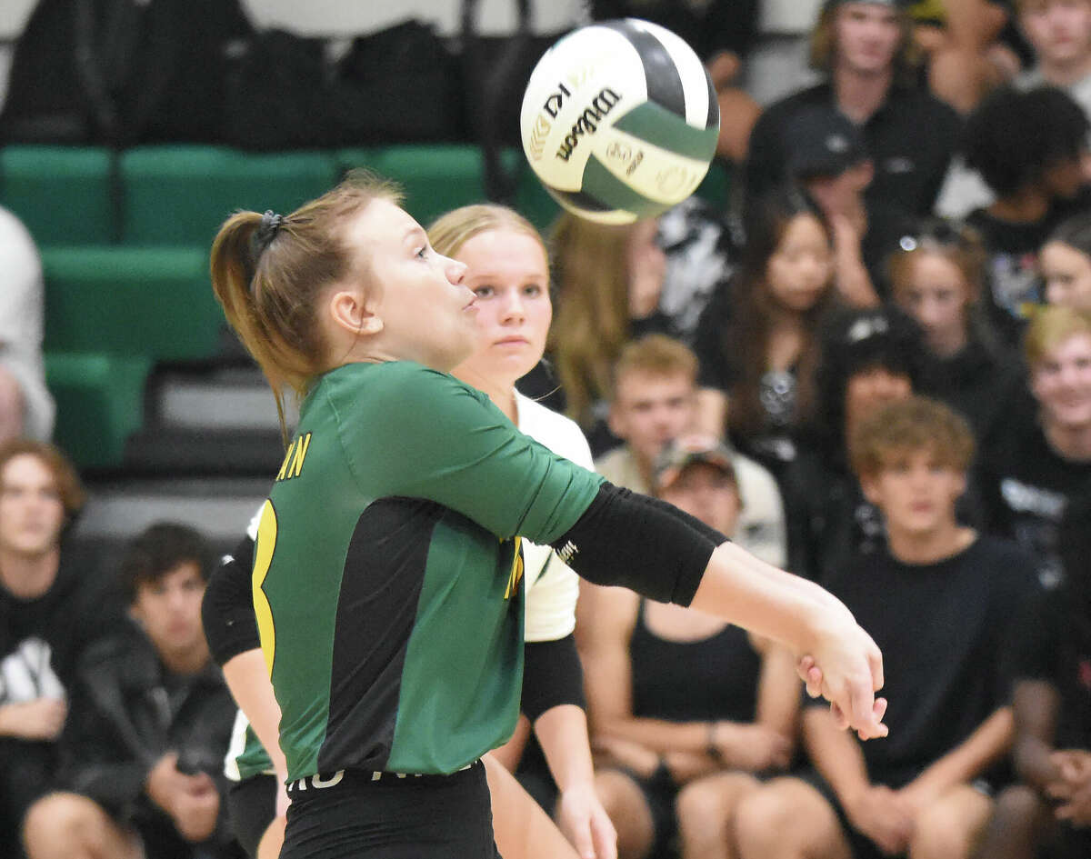 Metro-East Lutheran's Sidnee Schwarz receives a serve during a Gateway Metro Conference match on Thursday in Edwardsville.