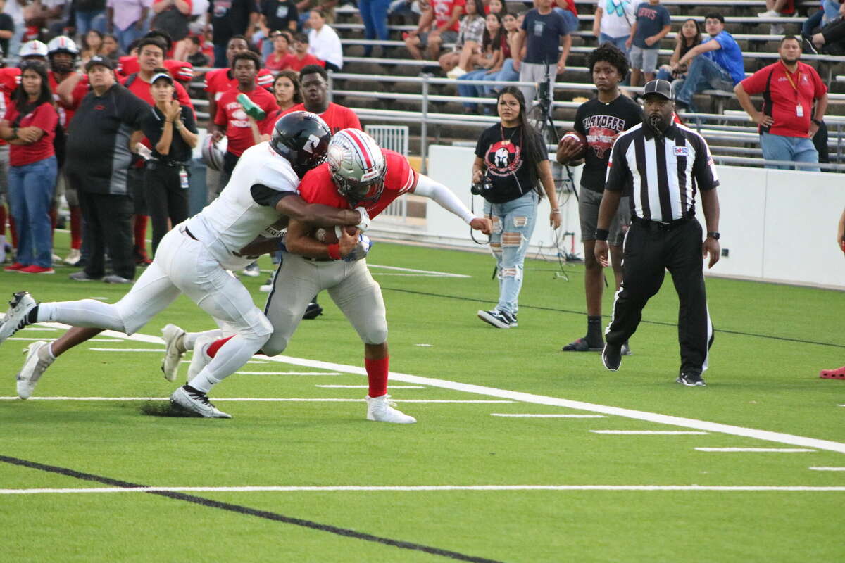 South Houston's Ivan Callixto runs for a seven-yard gain, getting his teammates inside the 10-yard line during the team's first scoring drive. It was all on the ground, culminating with a Webb run of one yard.