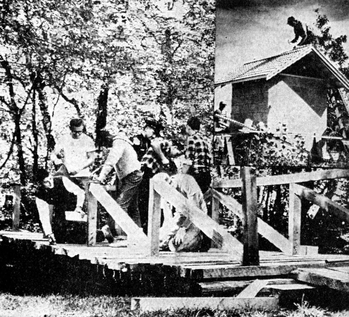 Explorer Scouts donated their time Saturday morning bridging the gap between the two picnic areas located at the south end of First Street Beach. The bridge work along with the pump house (inset photo) was being done in cooperation with the Manistee Jaycees overall beach project. The photo was published in the News Advocate on Sept. 17, 1962.