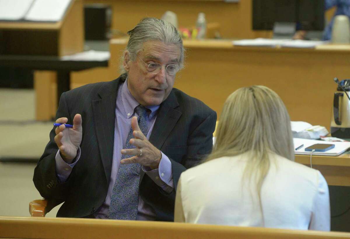 Norman Pattis, attorney for Alex Jones, in discussion with Brittany Paz, the corporate representative for Infowars, during the Alex Jones Sandy Hook defamation damages trial in Superior Court in Waterbury, Connecticut, Friday, September 16, 2022. H John Voorhees III / Hearst Connecticut Media.