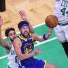 Golden State Warriors' Klay Thompson, 11, puts up a shot over Boston Celtics' Derrick White, 9, during the second quarter in Game 6 of the NBA Finals at TD Garden in Boston, Mass., on Thursday, June 16, 2022.