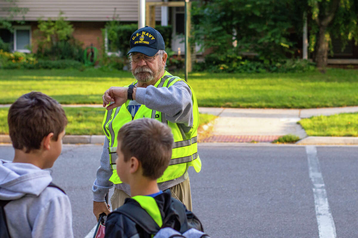 Elementary school patrol kids guarding the corners for safety. St